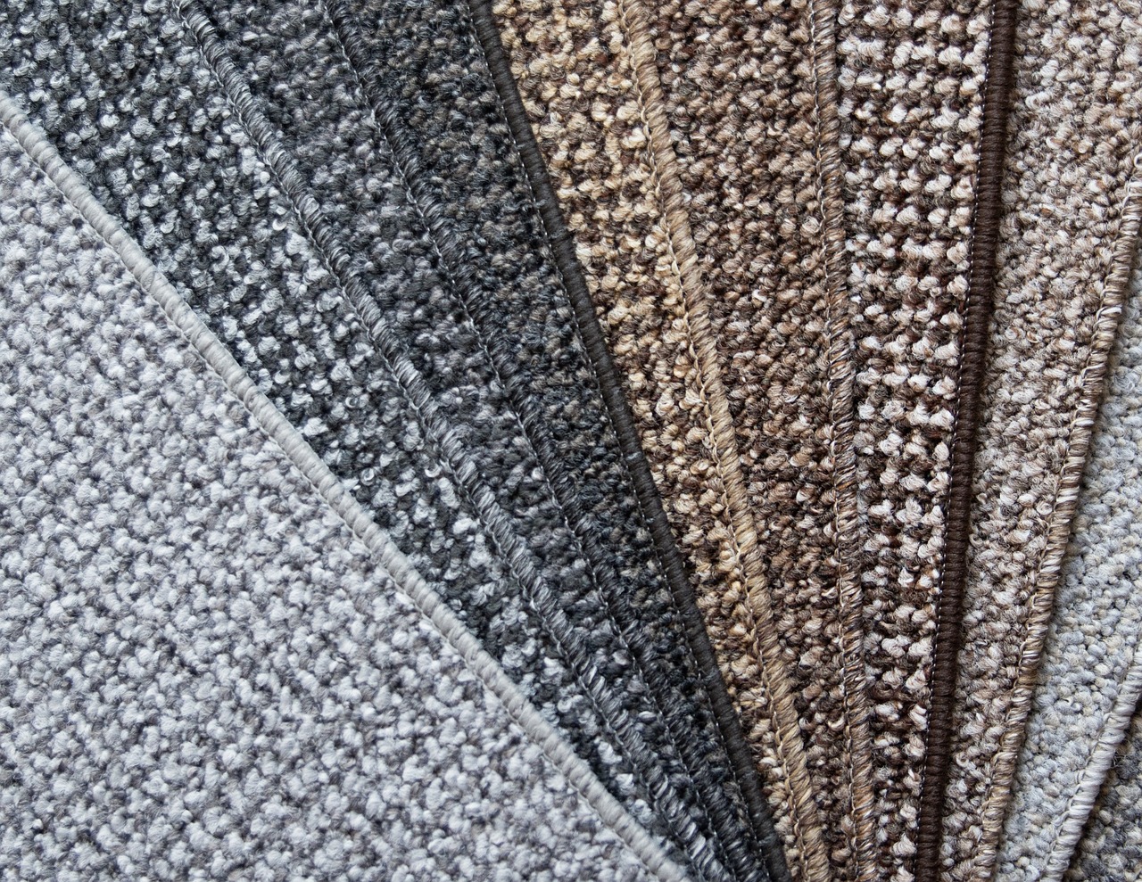 Wide selection of carpet samples in colors and textures available at Heart of Texas Flooring showroom in Brownwood TX