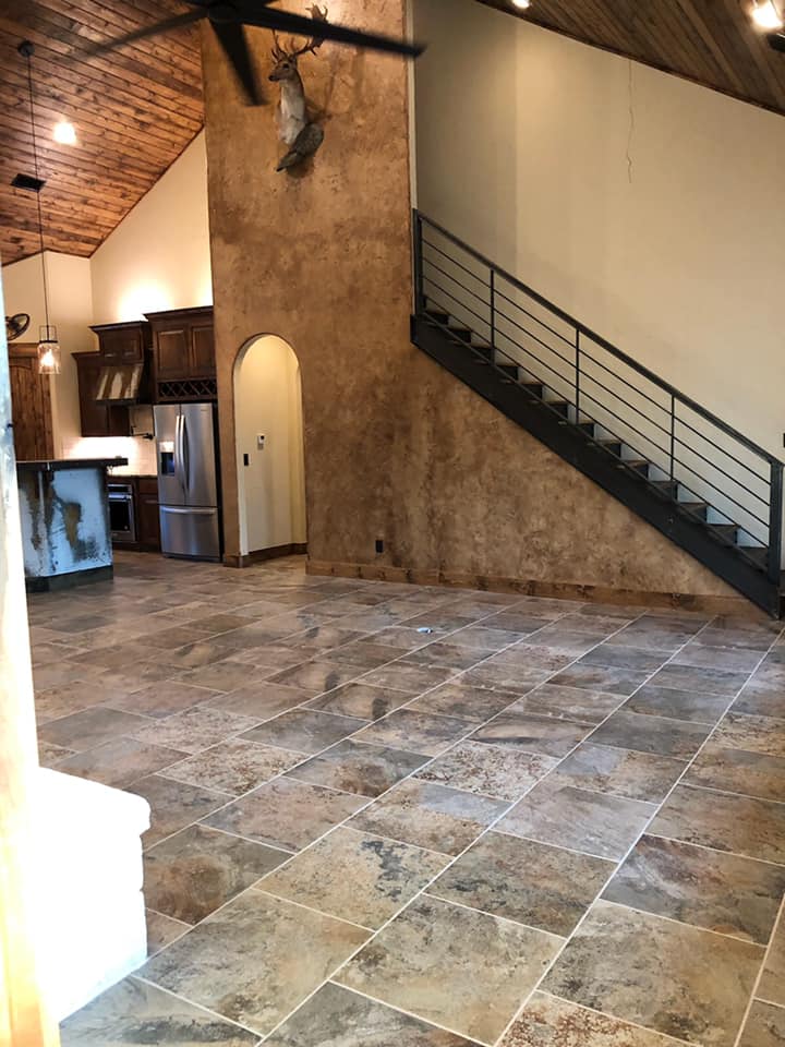 Large-format stone tile flooring installed in a great room in Brownwood TX — tile installation by Heart of Texas Flooring