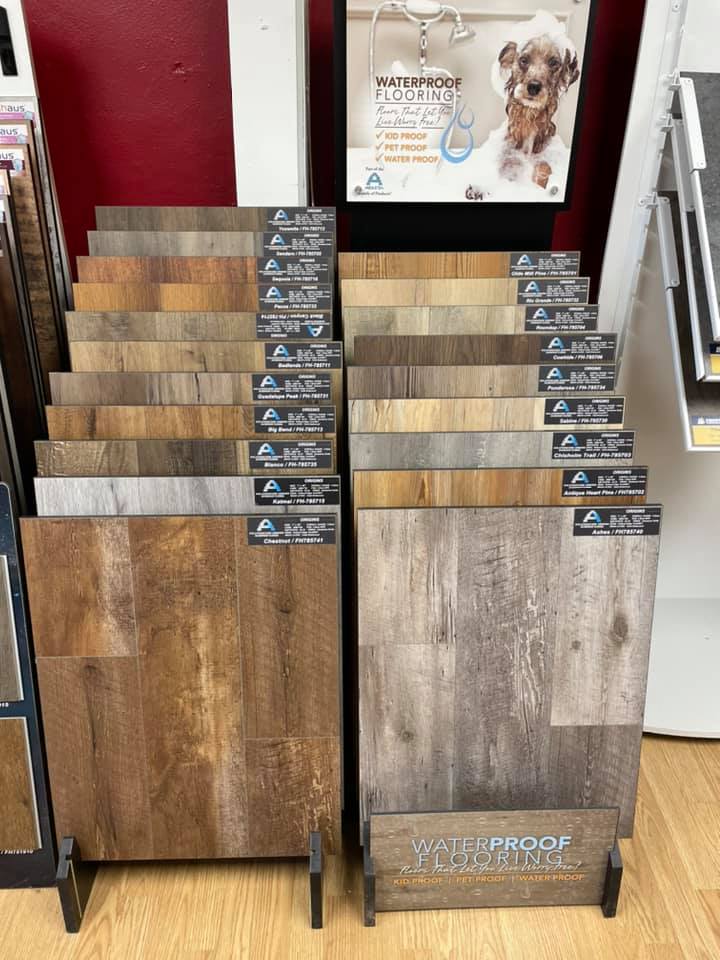 Waterproof and engineered hardwood flooring options on display at Heart of Texas Flooring showroom in Brownwood TX